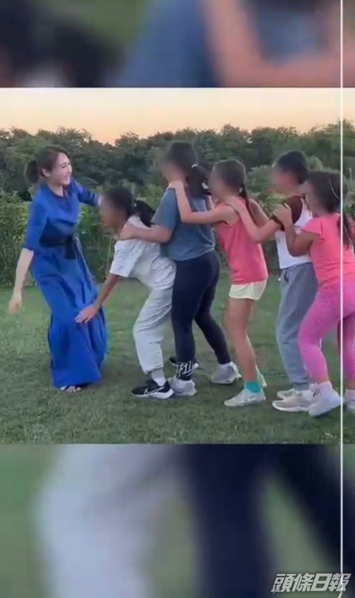 黎姿與小朋友玩麻鷹捉雞仔。